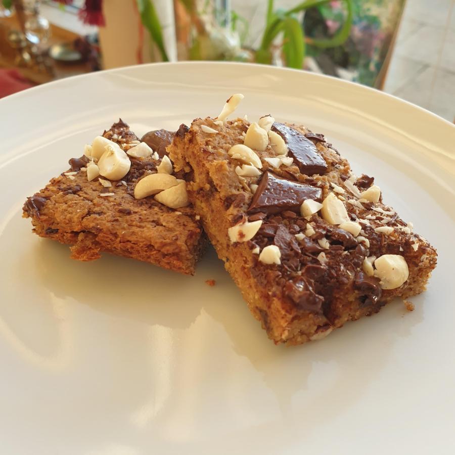 Vegan chickpea blondies with added nuts and chocolate on top